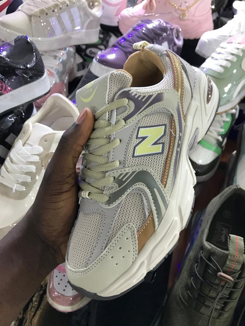 New Balance 530 in Beige/Tan and Light Blue (with yellow "N" logo)